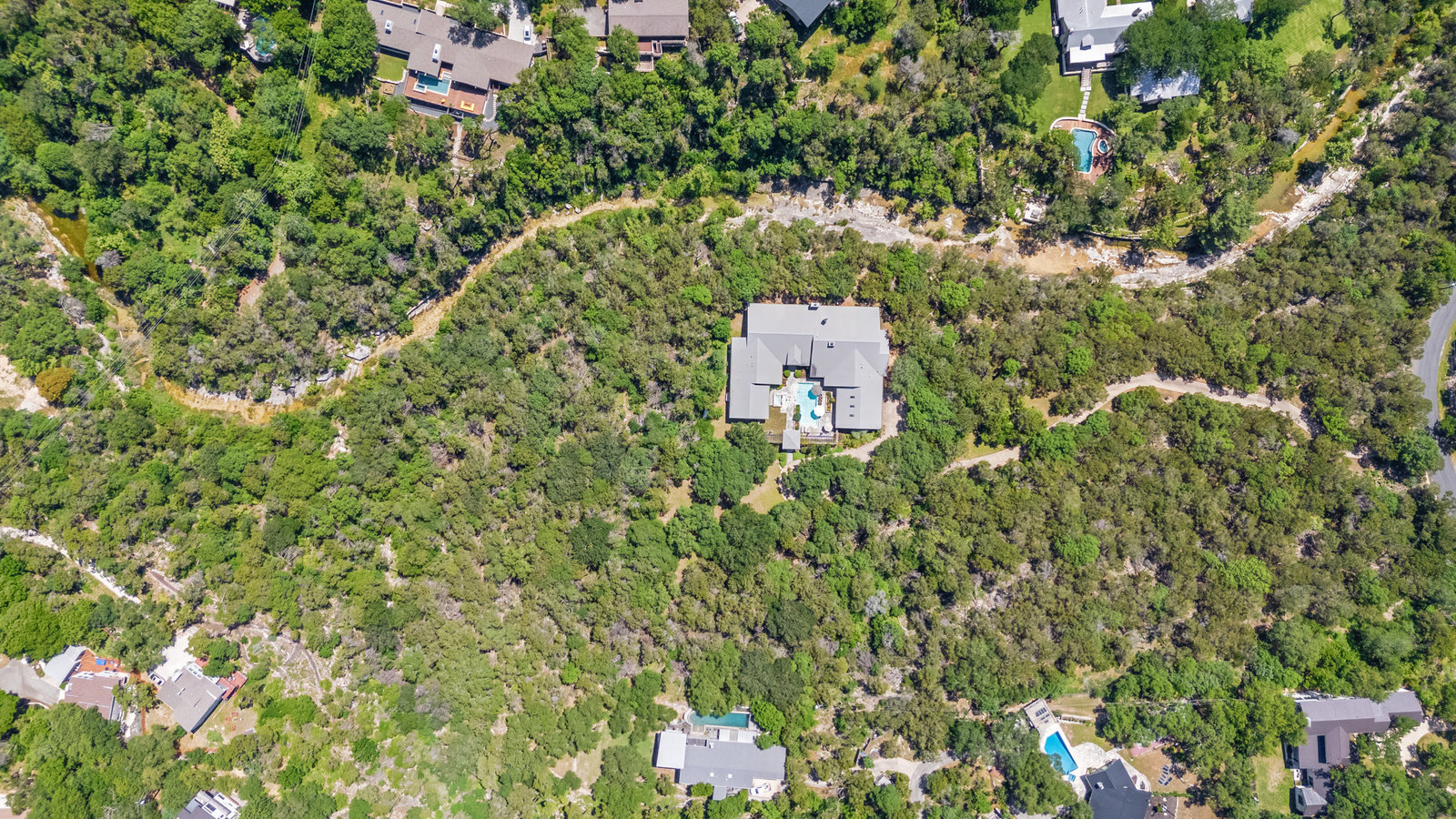 Aerial view of wooded Westlake acreage and privacy